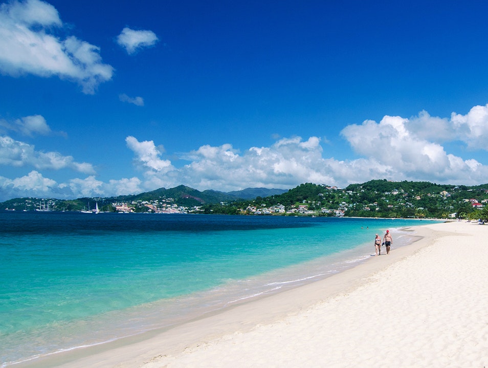 The longest of Grenada's 45 beaches, 2-mile long Grand Anse Beach with the view of capital city of St. George's