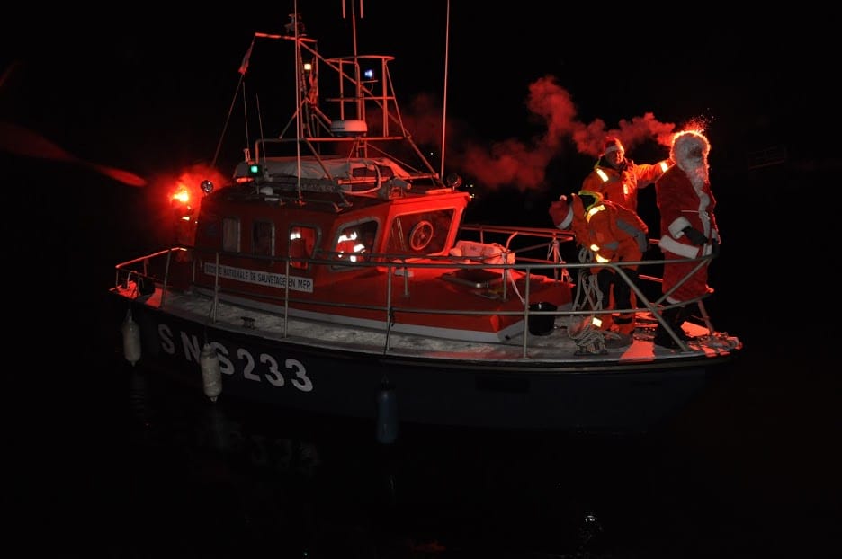 Not even darkness of night can stop the good work done by St. Nicholas. When he doesn't ride a reindeer sleight, he skippers a boat.